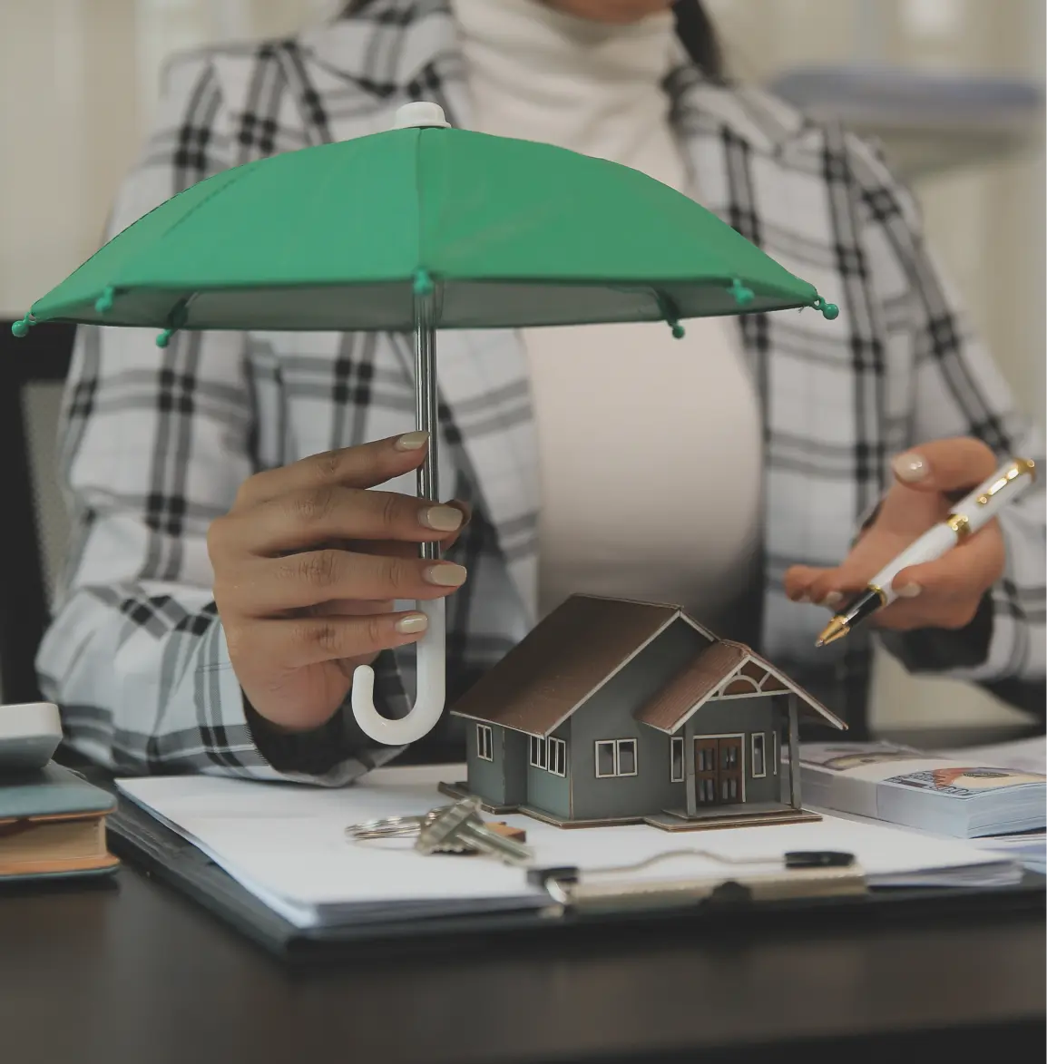 small house model under umbrella